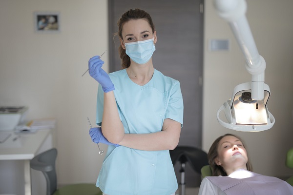 A Doctor examining patient for cavities